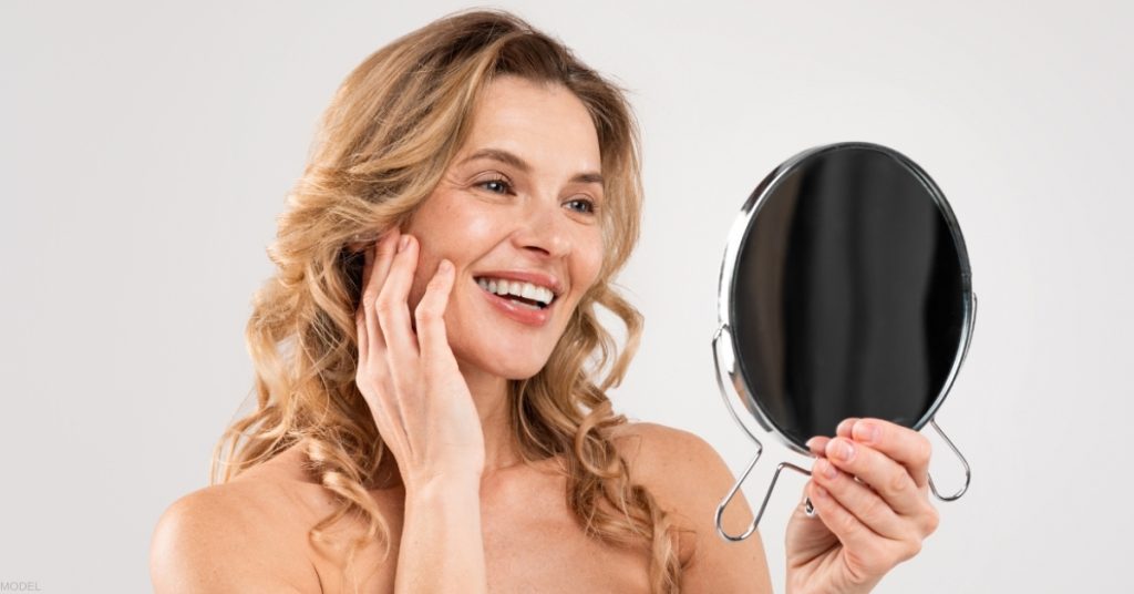 Woman smiling after VISIA® Skin Analysis (model)