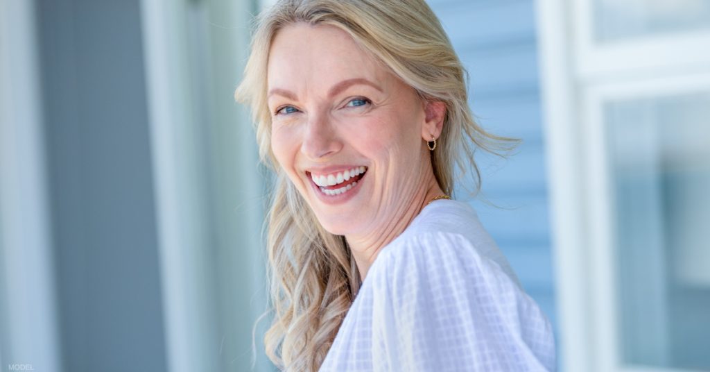 Woman smiling after facelift (model)