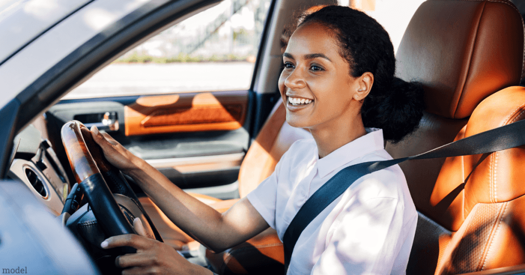 middle aged woman driving a car (model)